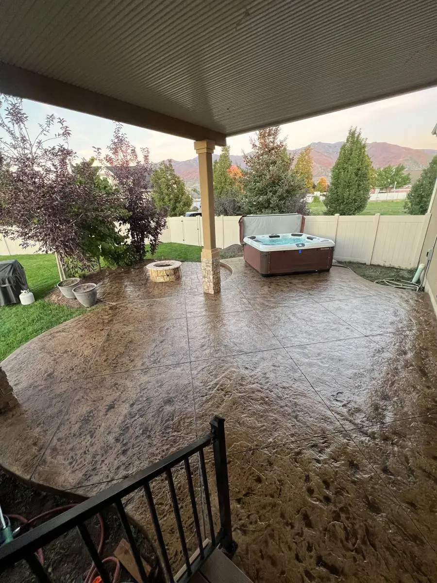 Stamped concrete walkway with antique release highlighting — stone pattern